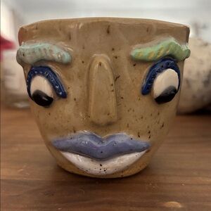 Handcrafted Beige Ceramic Face Planter with Blue Accents